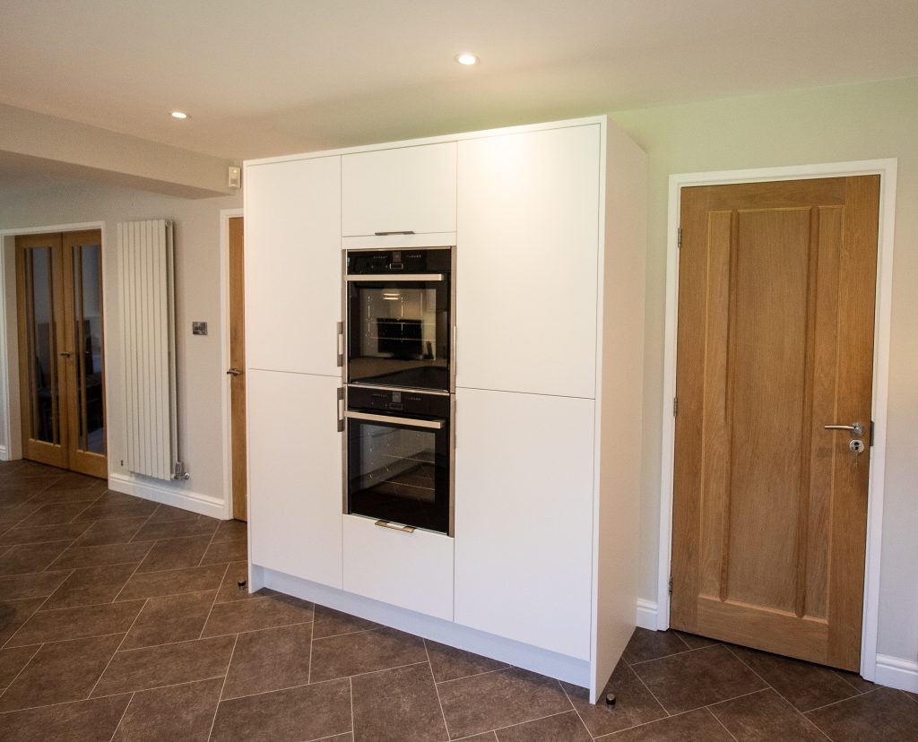 Matt white Otto doors by Burbidge, designed, supplied and installed by Noble Kitchens, Coventry and Warwickshire