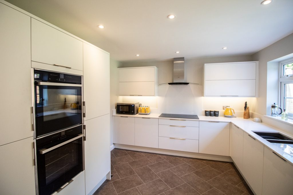 Matt white Otto doors by Burbidge, designed, supplied and installed by Noble Kitchens, Coventry and Warwickshire
